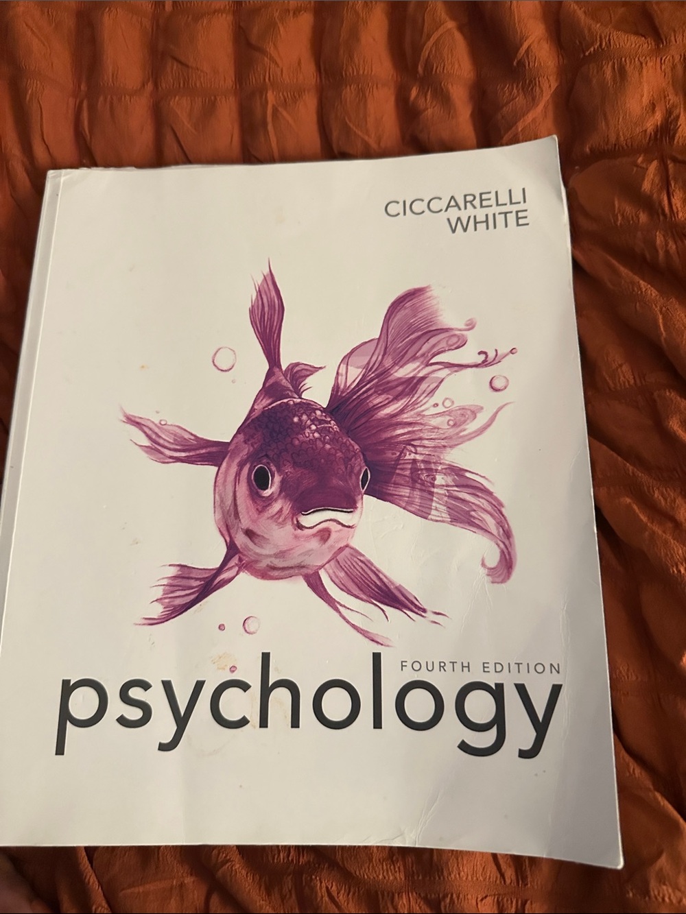 Psychology Textbook with Pink Fish Cover